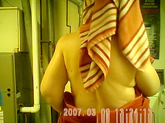 Mature chubby woman drying her body