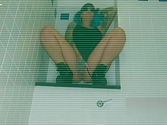 Ms Hayley B masturbating in a hotel bathroom she Squirts everywhere then licks her fingers
