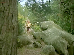 Naked cavegirl with perky tits in movie clip