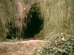 Naked cavegirl with perky tits in movie clip