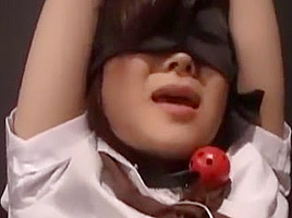 Oriental babe Blind folded ball gagged and kept in a cage