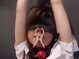 Oriental babe Blind folded ball gagged and kept in a cage