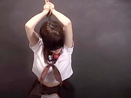Oriental babe Blind folded ball gagged and tied up
