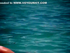Pale buttocks in a pink thong bikini