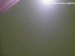 Pissing girl spied from above the wall