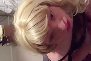 Pretty crossdresser sucks off her man