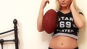 Sexy blonde loves soccer and feeling her huge tits