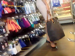 Sexy blonde milf in a store