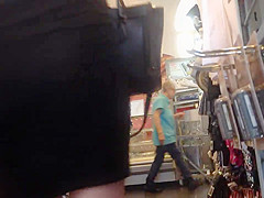 Sexy blonde milf in a store