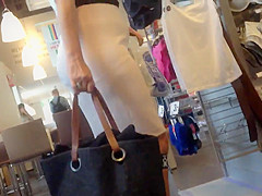 Sexy blonde milf in a store