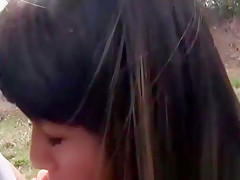 Sexy brunette babe Mona Kim sucking and fucking outdoor