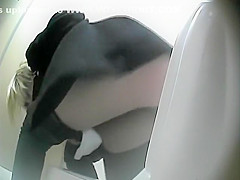 Sexy woman caught pissing in the toilet