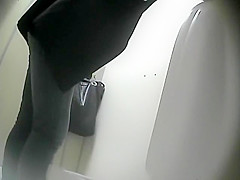 Sexy woman caught pissing in the toilet