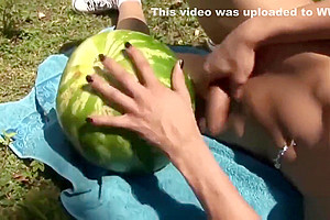 Shemale fucks a watermelon