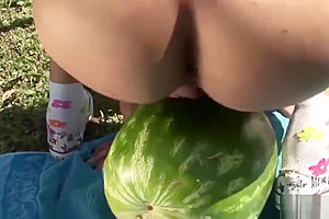 Shemale fucks a watermelon