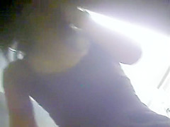 Sneaky guy gets to film this sexy young woman getting undre