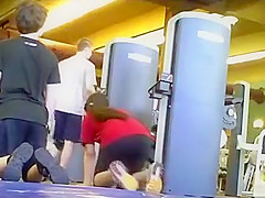 Sporty ass brunette works out in the gym
