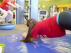 Sporty ass brunette works out in the gym