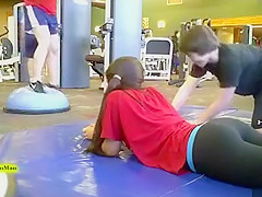 Sporty ass brunette works out in the gym