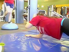 Sporty ass brunette works out in the gym