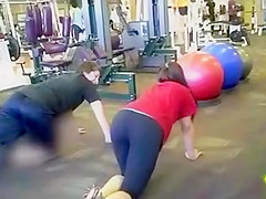 Sporty ass brunette works out in the gym