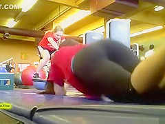 Sporty ass brunette works out in the gym