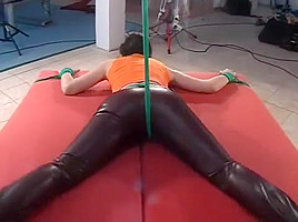 Spreadeagled tied facedownin leather trousers