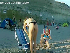 Spying a bent over beach babe