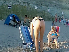 Spying a bent over beach babe