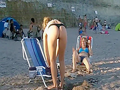 Spying a bent over beach babe
