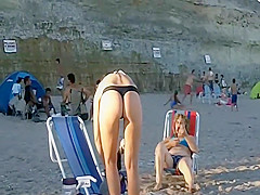 Spying a bent over beach babe