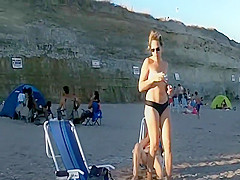 Spying a bent over beach babe