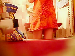 Spying a bent over wife in the bathroom