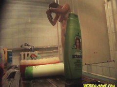Spying real slim beauty shaving in a public shower