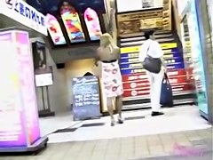 Tan blonde asian gets skirt sharked in a crowded place 
