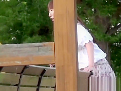 Tantalizing Japanese in skirt peeing behind bench in park
