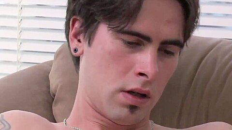 Tattoed Troy massages his cock erect alone for pleasure