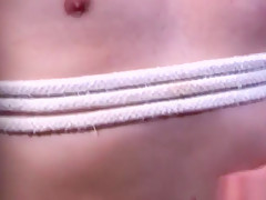 Top stud binds bottom and jerks his cock