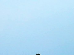 Topless sleek hotties on the nude beach getting filmed by a