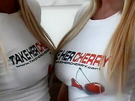 Two Teenage Blondes Dressed Appropriate For The Christmas Spirit