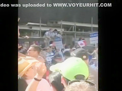 Undressed girl with small tits on a parade float