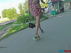 Upskirt porn with brunette-hair gal in a public place