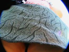 Upskirt video of a brunette milf