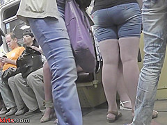 Upskirting thong footage of a brunette in mini skirt