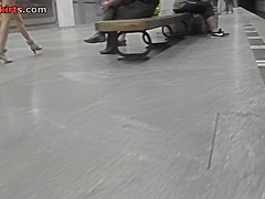 Upskirting thong footage of a brunette in mini skirt