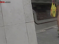 Upskirting thong footage of a brunette in mini skirt