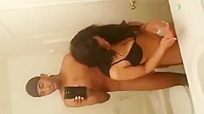 Watch hot brunette babe with black male in bathroom