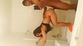 Watch hot brunette babe with black male in bathroom