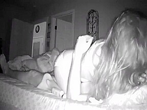 Wife giving handjob to husband on