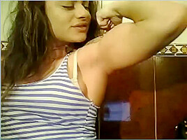 Wild Angel kisses her muscles